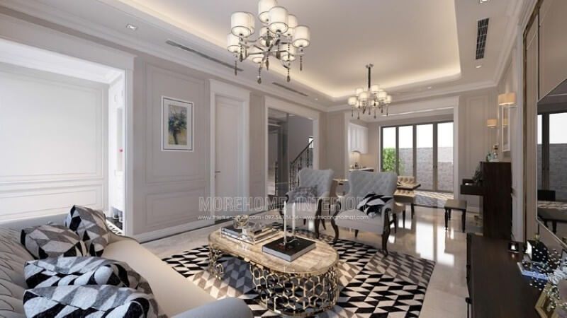 Thiết kế nội thất phòng khách thoải mái, sáng sủa với mẫu đồ nội thất tự nhiên màu trắng sữa kết hợp với các chi tiết đen lôi cuốn.